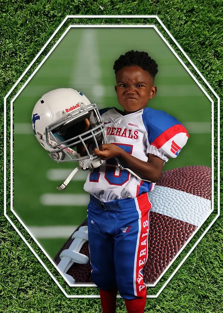 Football player in a Federals uniform holding his helmet
